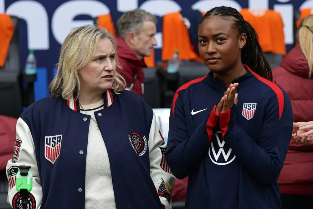 U.S. women's soccer coach Emma Hayes, left, looks to her left as Jaedyn Shaw holds her hands together before a SheBelieves Cup match at Sports Illustrated Stadium.