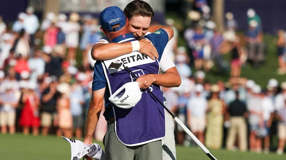 Kristoffer Reitan of Norway hugs his caddie on the 18th hole green after winning the Truist Championship 2026 at Quail Hollow Country Club on May 10, 2026 in Charlotte, North Carolina. (Photo by Andrew Redington/Getty Images)